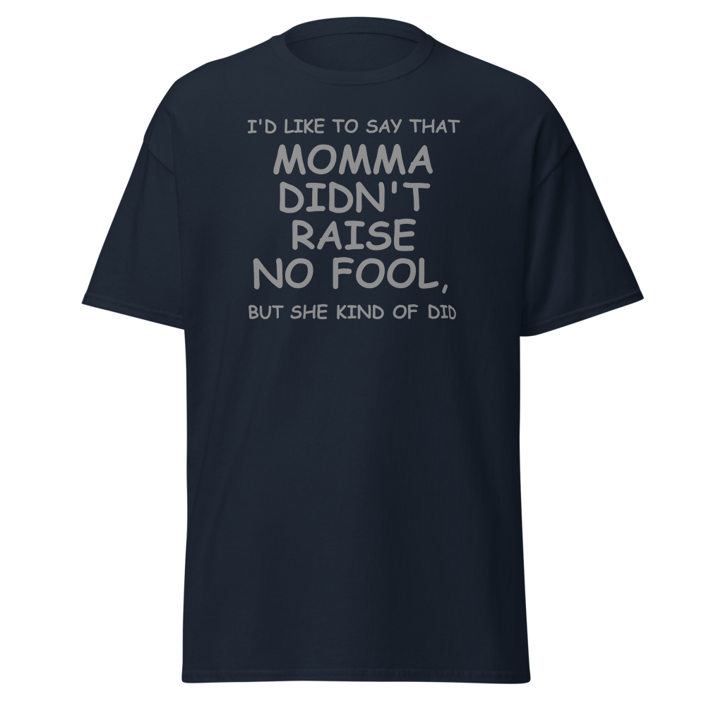 "I'd like to say that momma didn't raise no fool, but she kind of did" printed on a navy unisex classic tee laying on a flat surface