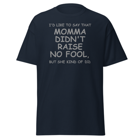 "I'd like to say that momma didn't raise no fool, but she kind of did" printed on a navy unisex classic tee laying on a flat surface