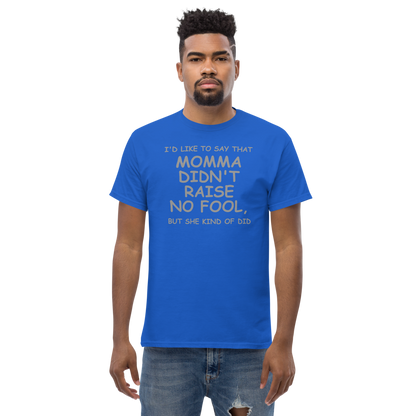 "I'd like to say that momma didn't raise no fool, but she kind of did" printed on a royal unisex classic tee worn by a male