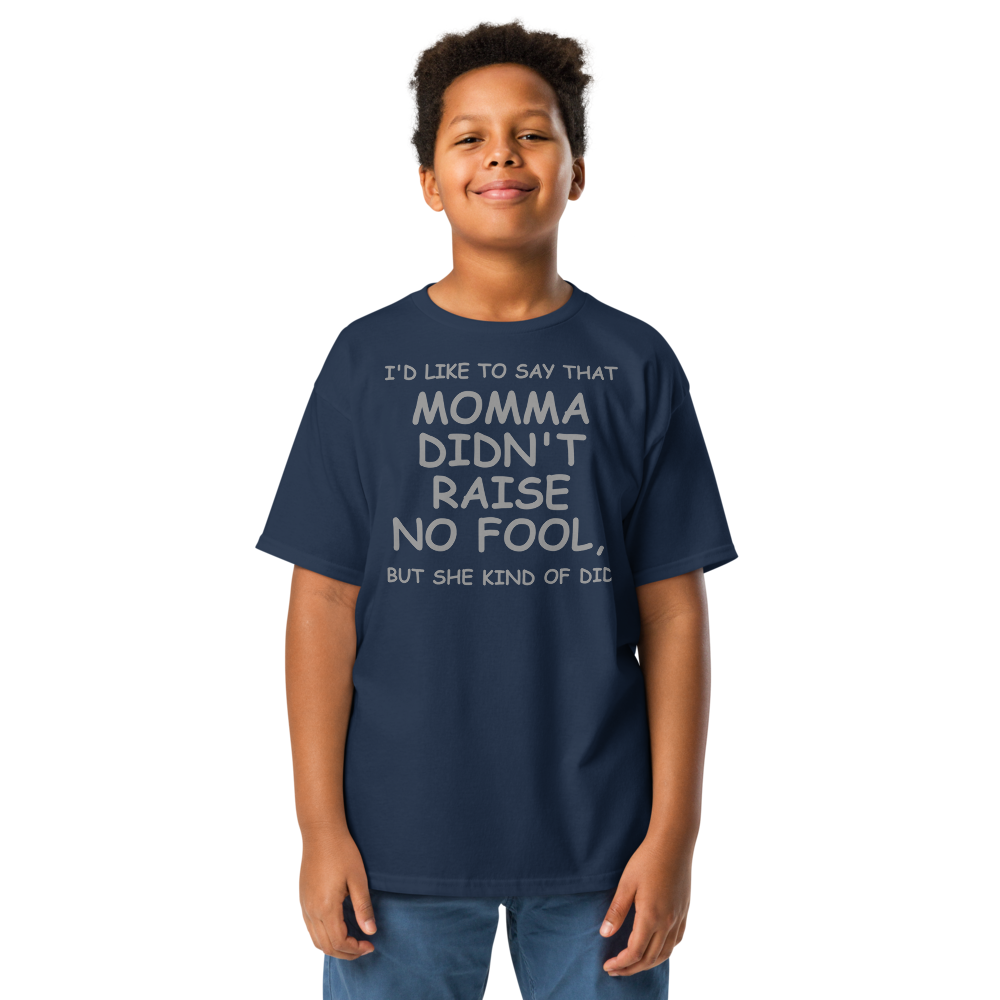 "I'd like to say that momma didn't raise no fool, but she kind of did" printed on a navy youth classic tee worn by a male
