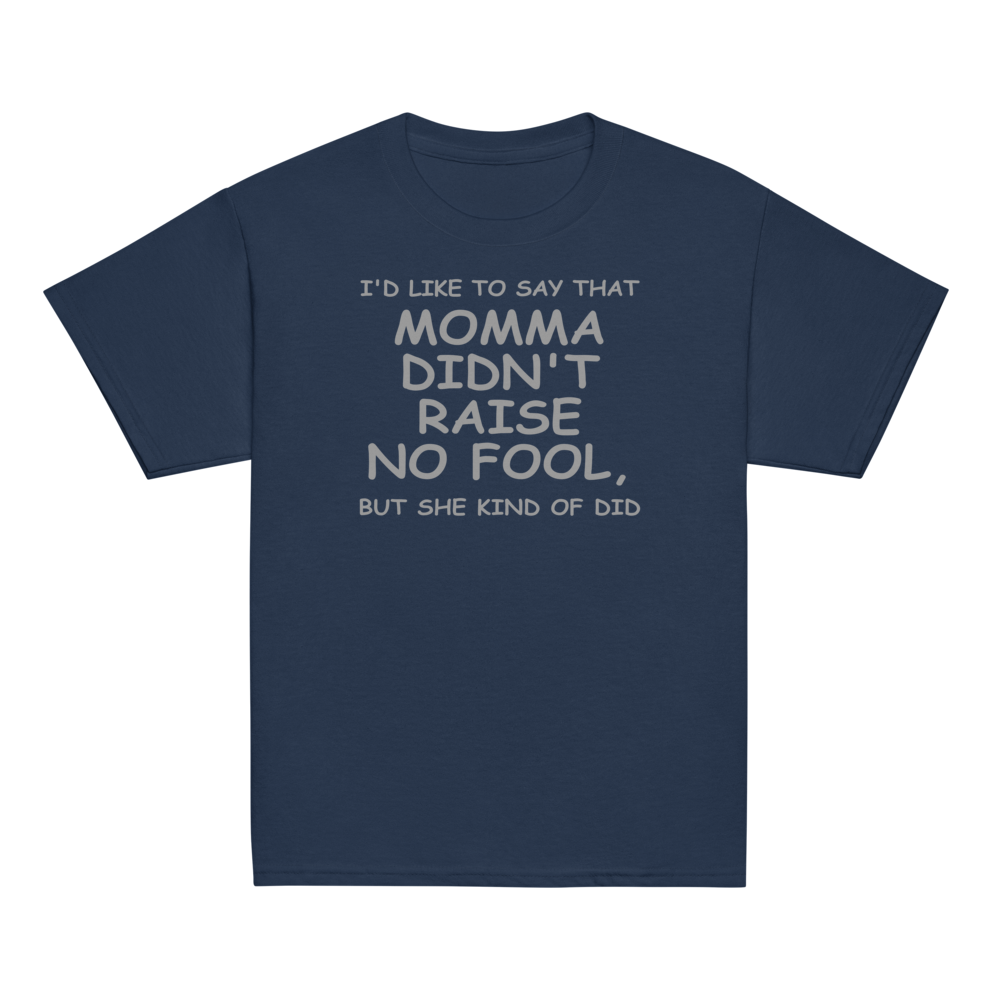 "I'd like to say that momma didn't raise no fool, but she kind of did" printed on a navy youth classic tee laying on a flat surface