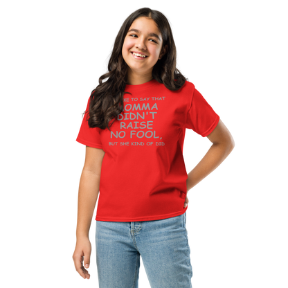 "I'd like to say that momma didn't raise no fool, but she kind of did" printed on a red youth classic tee worn by a female