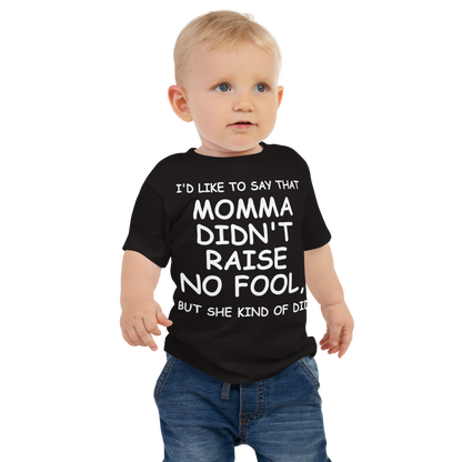 "I'd like to say that momma didn't raise no fool, but she kind of did" printed on a black baby jersey short sleeve tee worn by a male