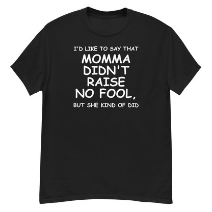 "I'd like to say that momma didn't raise no fool, but she kind of did" printed on a black unisex classic tee laying on a flat surface