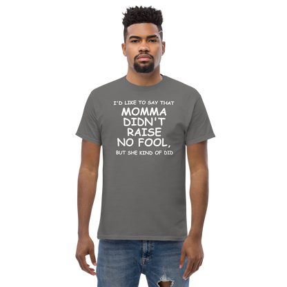 "I'd like to say that momma didn't raise no fool, but she kind of did" printed on a charcoal unisex classic tee worn by a male