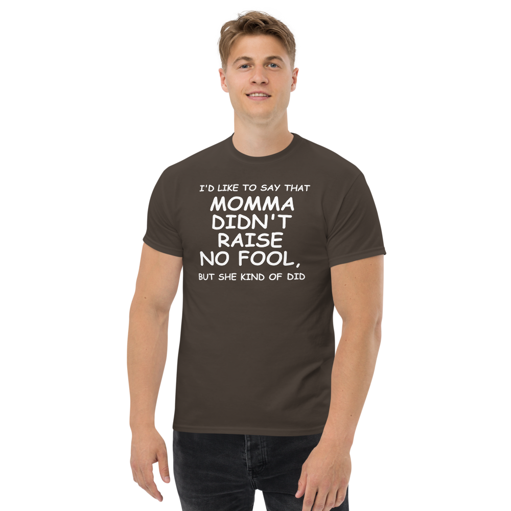 "I'd like to say that momma didn't raise no fool, but she kind of did" printed on a dark chocolate unisex classic tee worn by a male