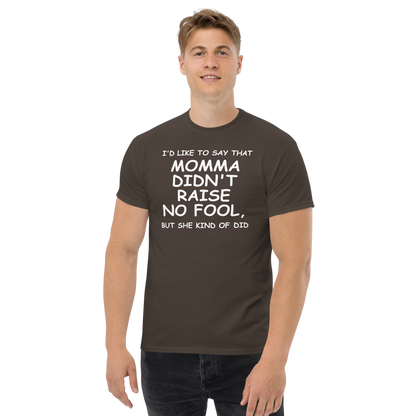 "I'd like to say that momma didn't raise no fool, but she kind of did" printed on a dark chocolate unisex classic tee worn by a male