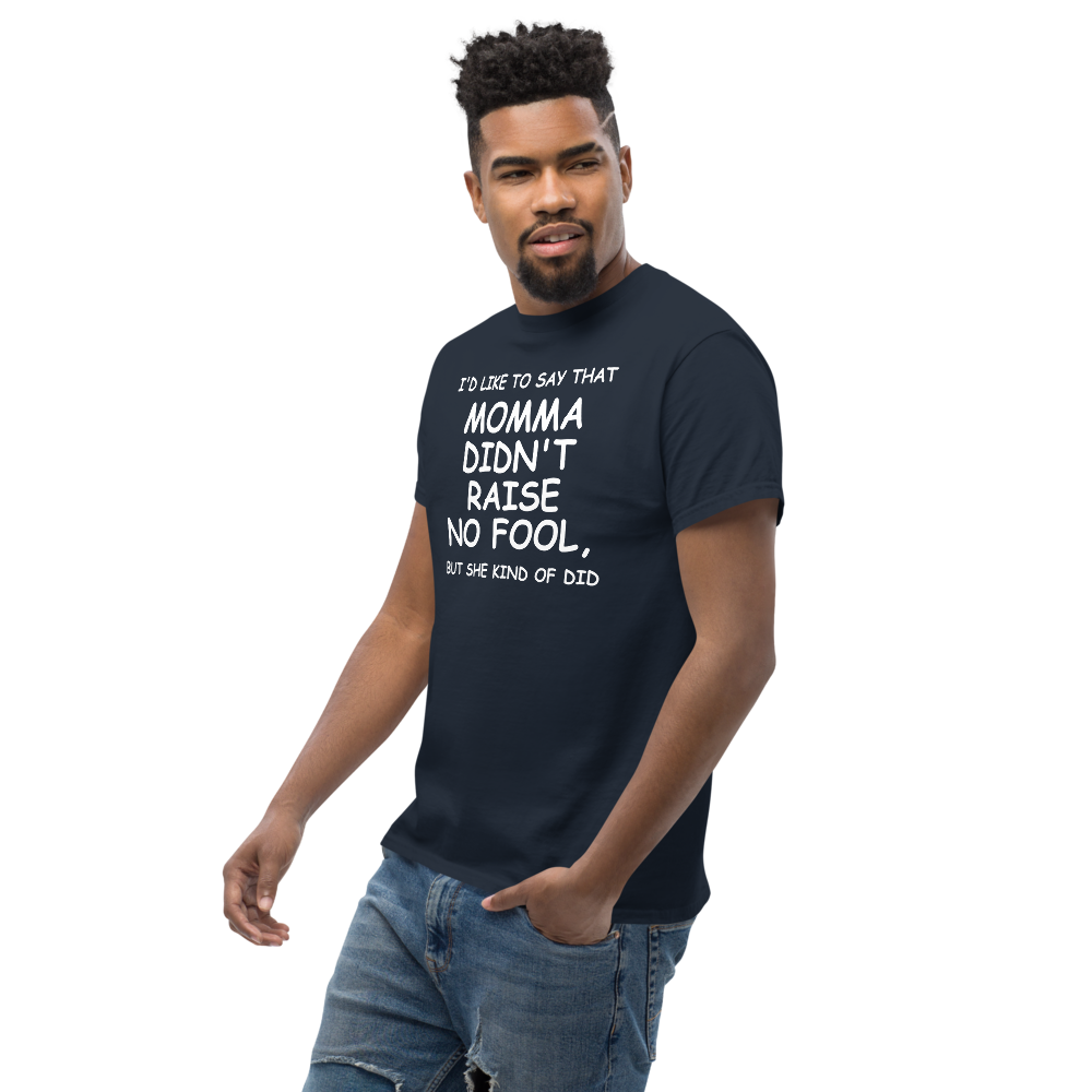"I'd like to say that momma didn't raise no fool, but she kind of did" printed on a navy unisex classic tee worn by a male