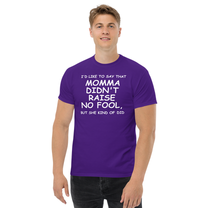 "I'd like to say that momma didn't raise no fool, but she kind of did" printed on a purple unisex classic tee worn by a male