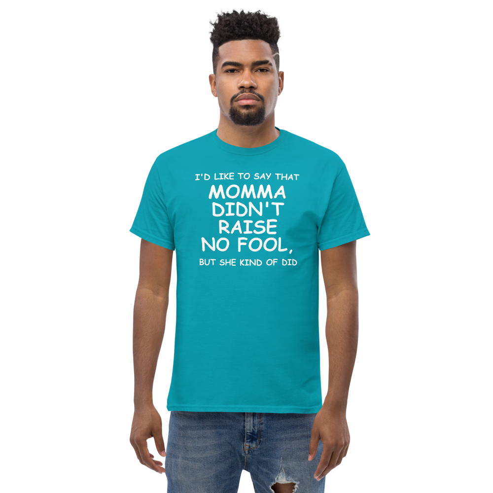 "I'd like to say that momma didn't raise no fool, but she kind of did" printed on a tropical blue unisex classic tee worn by a male