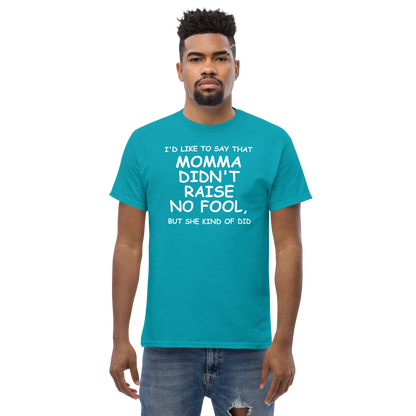 "I'd like to say that momma didn't raise no fool, but she kind of did" printed on a tropical blue unisex classic tee worn by a male