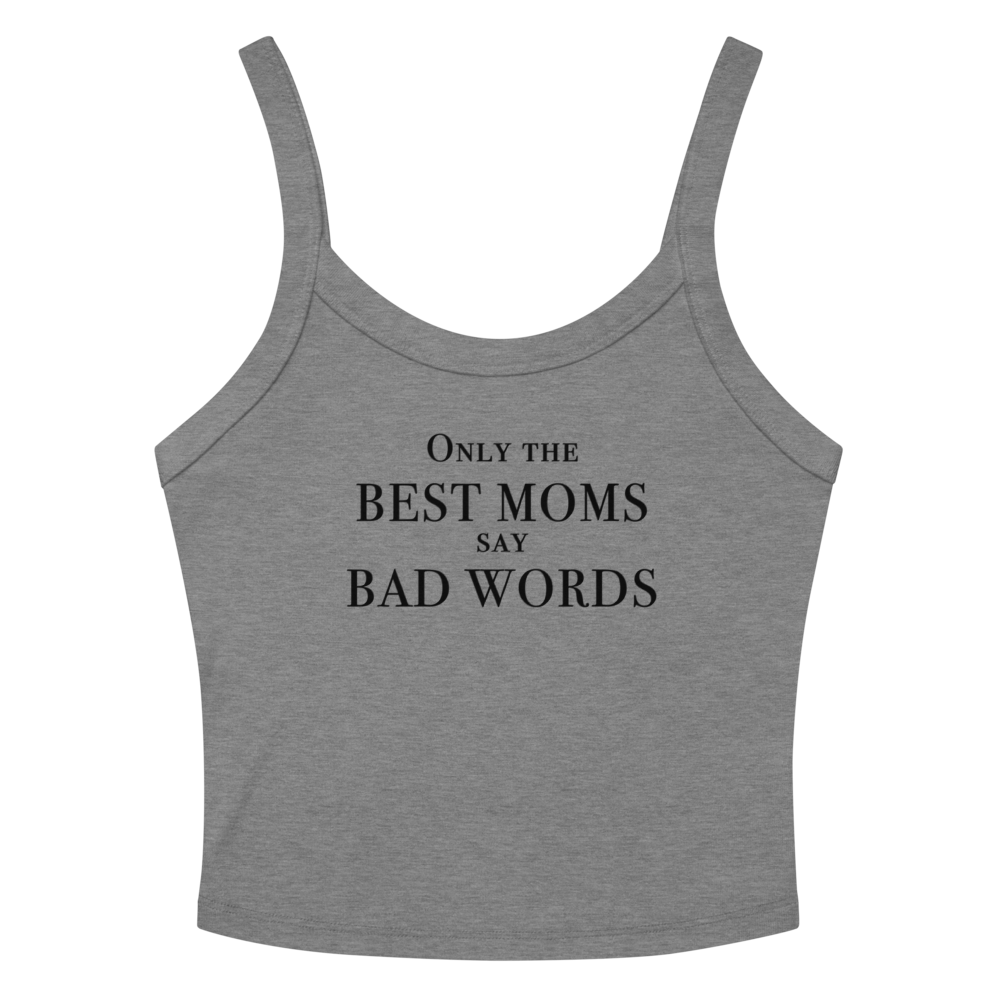 "Only the best moms say bad words" printed on a athletic heather women's micro-rib tanktop laying on a flat surface amongst sunglasses and shorts