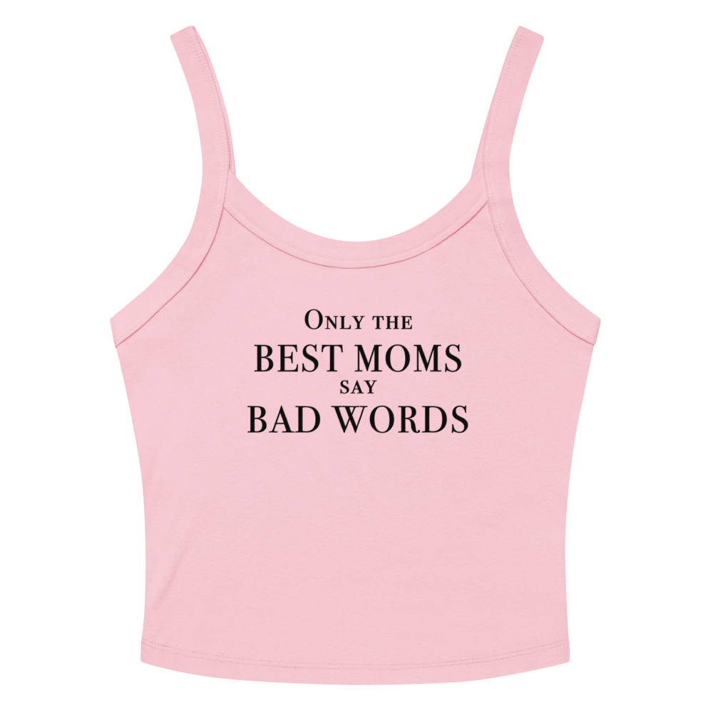 "Only the best moms say bad words" printed on a solid pink blend women's micro-rib tanktop laying on a flat surface amongst sunglasses and shorts