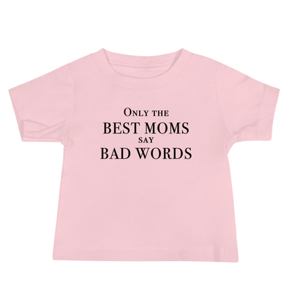 "Only the best moms say bad words" printed on a pink baby jersey short sleeve tee laying on a flat surface