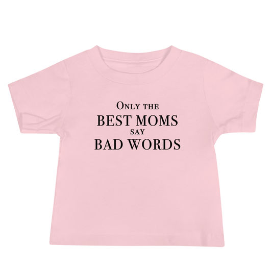 "Only the best moms say bad words" printed on a pink baby jersey short sleeve tee laying on a flat surface