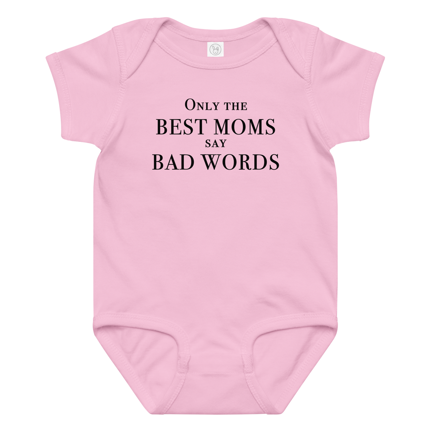 "Only the best moms say bad words" printed on a pink baby jersey bodysuit laying on a flat surface amongst other clothes