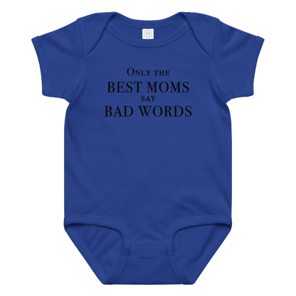 "Only the best moms say bad words" printed on a royal baby jersey bodysuit laying on a flat surface amongst other clothes