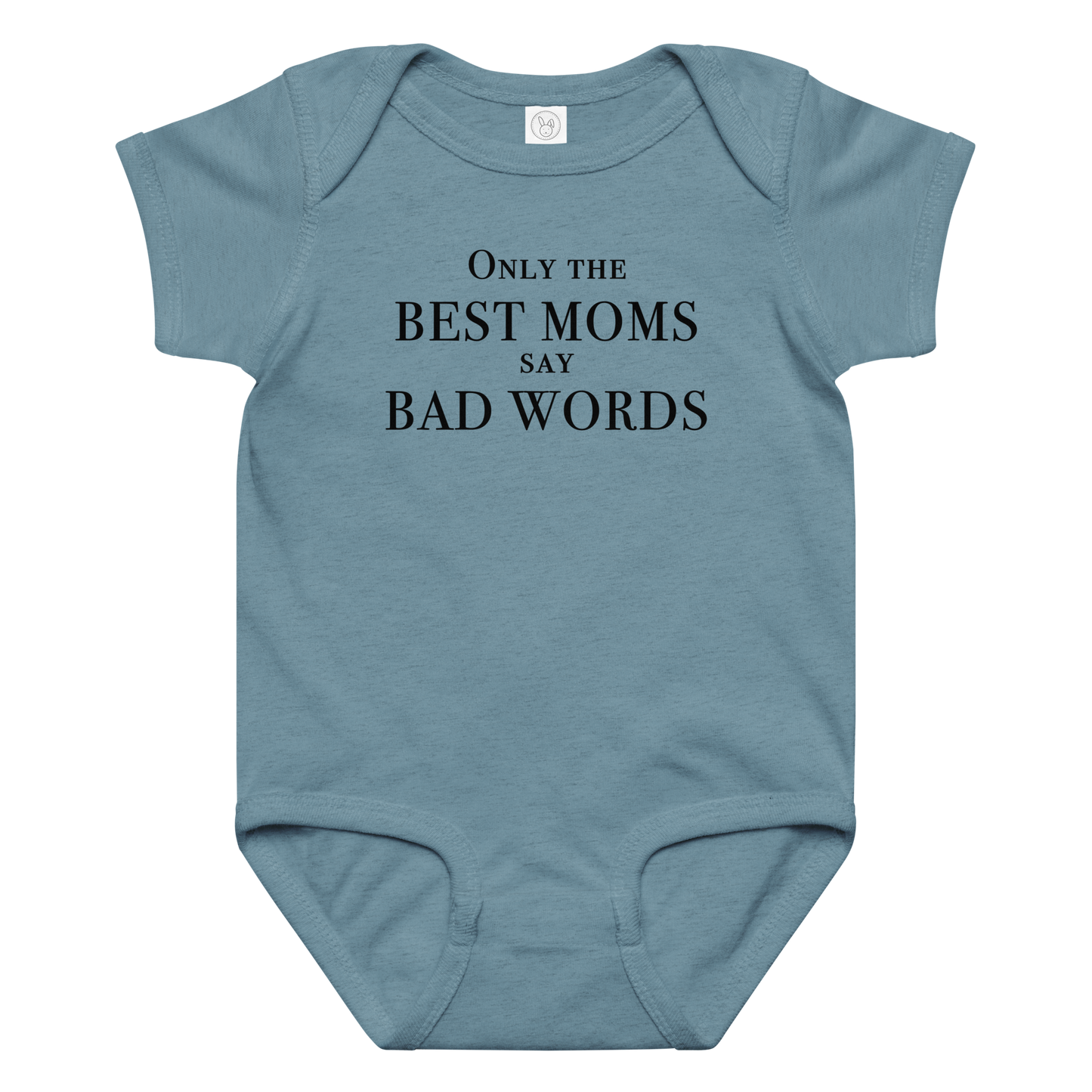 "Only the best moms say bad words" printed on a vintage indigo baby jersey bodysuit laying on a flat surface amongst other clothes