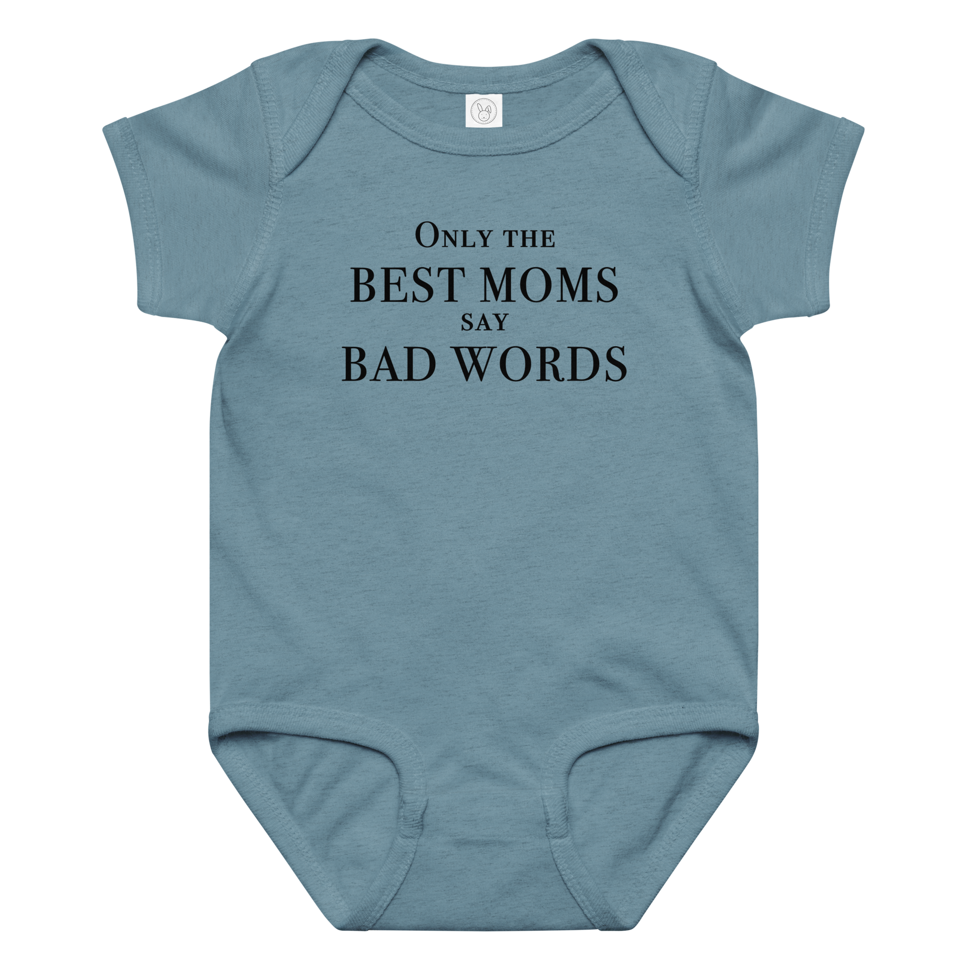 "Only the best moms say bad words" printed on a vintage indigo baby jersey bodysuit laying on a flat surface amongst other clothes