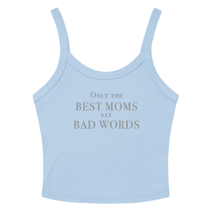 "Only the best moms say bad words" printed on a solid baby blue blend women's micro-rib tanktop laying on a flat surface amongst sunglasses and shorts