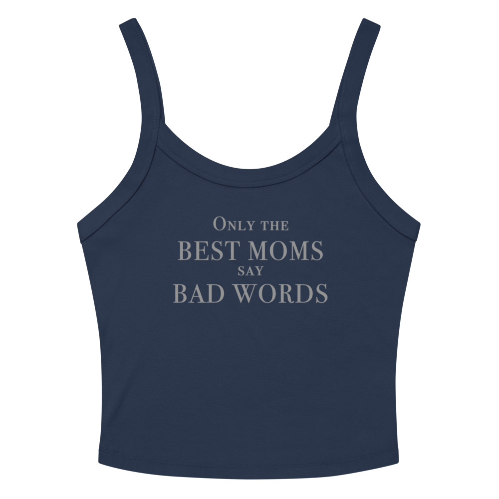 "Only the best moms say bad words" printed on a solid navy blend women's micro-rib tanktop laying on a flat surface amongst sunglasses and shorts