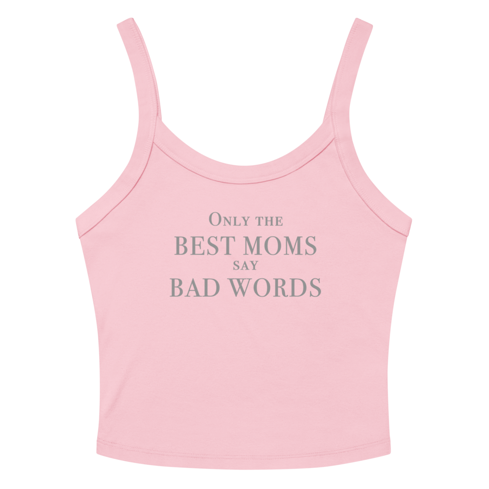 "Only the best moms say bad words" printed on a solid pink blend women's micro-rib tanktop laying on a flat surface amongst sunglasses and shorts