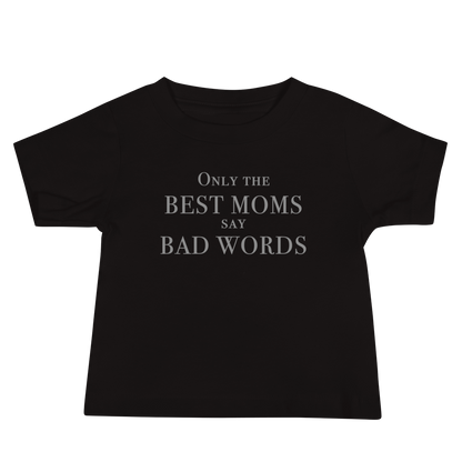 "Only the best moms say bad words" printed on a black baby jersey short sleeve tee laying on a flat surface