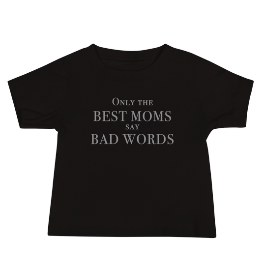 "Only the best moms say bad words" printed on a black baby jersey short sleeve tee laying on a flat surface