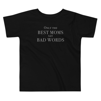"Only the best moms say bad words" printed on a black toddler short sleeve tee laying on a flat surface