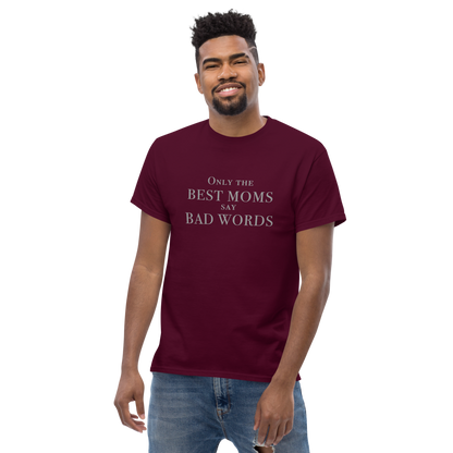 "Only the best moms say bad words" printed on a maroon unisex classic tee worn by a male