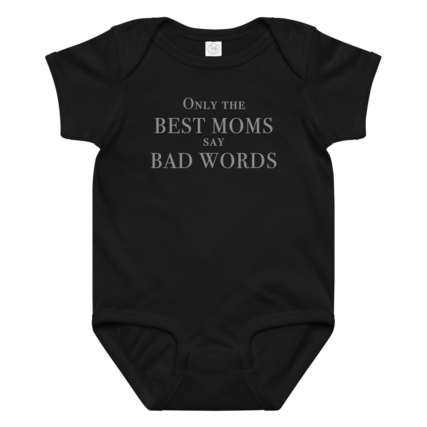 "Only the best moms say bad words" printed on a black baby jersey bodysuit laying on a flat surface amongst other clothes