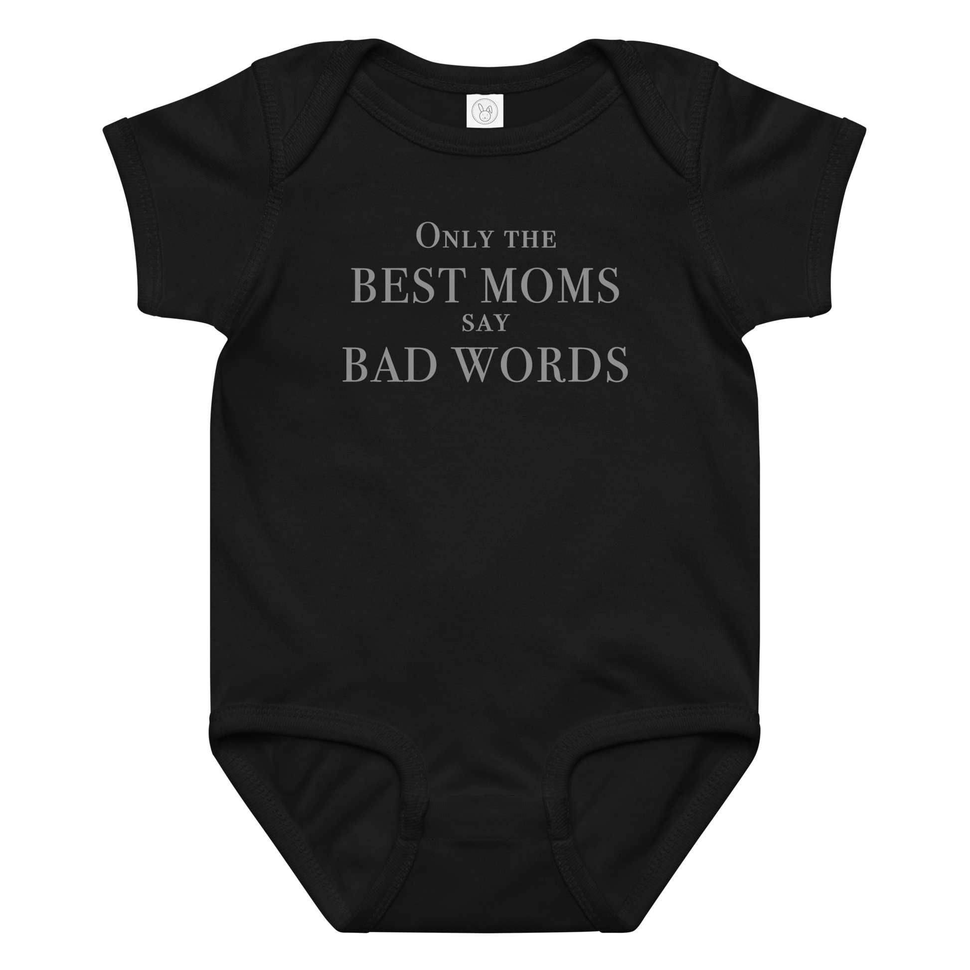 "Only the best moms say bad words" printed on a black baby jersey bodysuit laying on a flat surface amongst other clothes