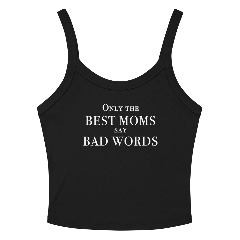 "Only the best moms say bad words" printed on a solid black blend women's micro-rib tanktop laying on a flat surface amongst sunglasses and shorts