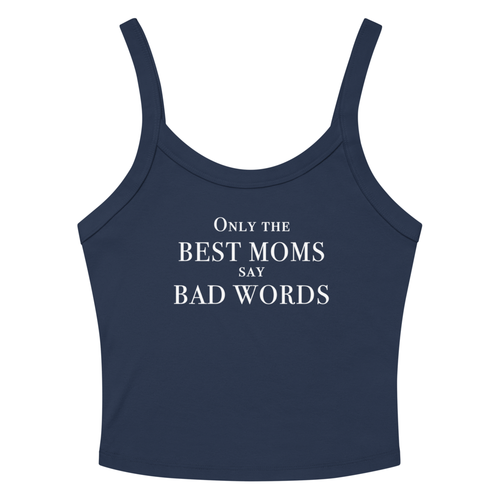 "Only the best moms say bad words" printed on a solid navy blend women's micro-rib tanktop laying on a flat surface amongst sunglasses and shorts