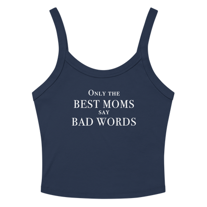 "Only the best moms say bad words" printed on a solid navy blend women's micro-rib tanktop laying on a flat surface amongst sunglasses and shorts