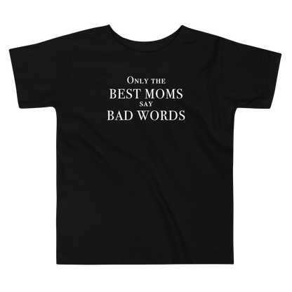 "Only the best moms say bad words" printed on a black toddler short sleeve tee laying on a flat surface