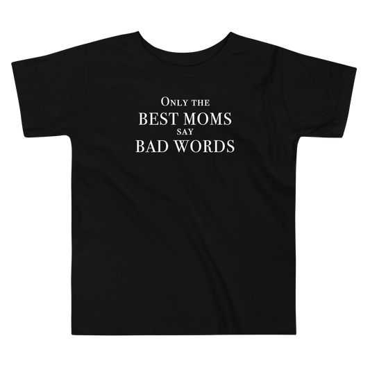 "Only the best moms say bad words" printed on a black toddler short sleeve tee laying on a flat surface