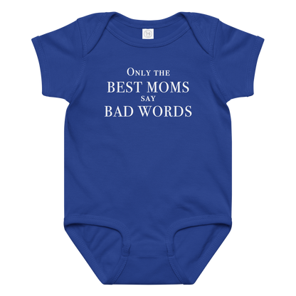 "Only the best moms say bad words" printed on a royal baby jersey bodysuit laying on a flat surface amongst other clothes