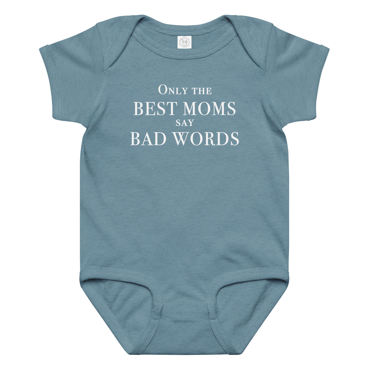 "Only the best moms say bad words" printed on a vintage indigo baby jersey bodysuit laying on a flat surface amongst other clothes