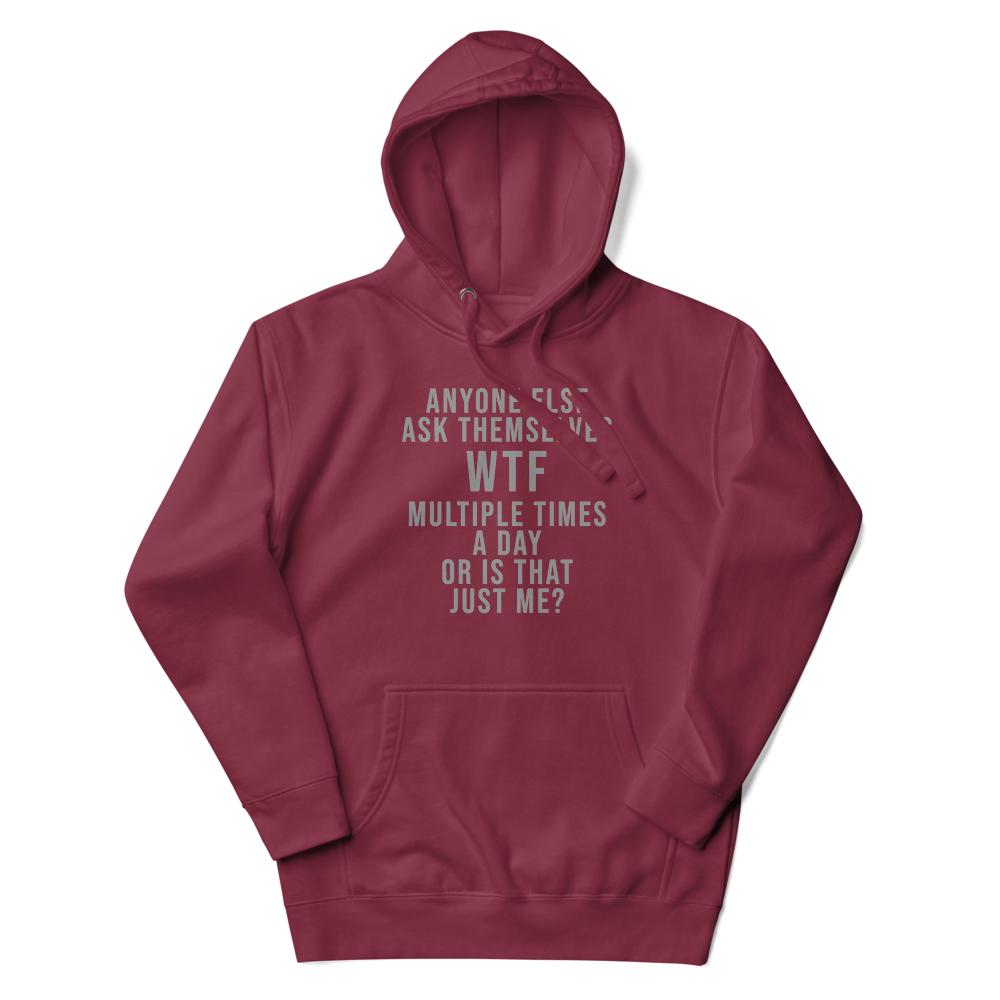 "Anyone else ask themselves WTF multiple times a day or is that just me?" printed on a maroon unisex hoodie laying on a flat surface with the hood up