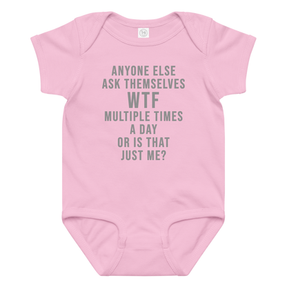 "Anyone else ask themselves WTF multiple times a day or is that just me?" printed on a pink baby jersey bodysuit laying on a flat surface amongst other clothes