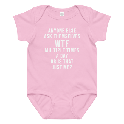 "Anyone else ask themselves WTF multiple times a day or is that just me?" printed on a pink baby jersey bodysuit laying on a flat surface amongst other clothes