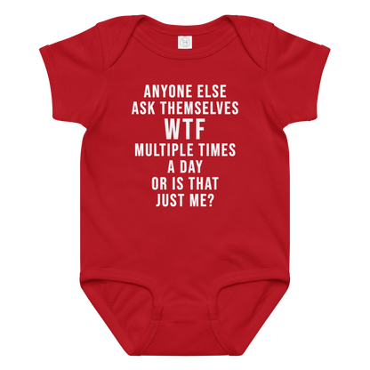 "Anyone else ask themselves WTF multiple times a day or is that just me?" printed on a red baby jersey bodysuit laying on a flat surface amongst other clothes