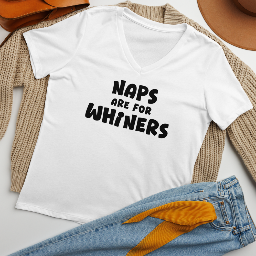 "Naps Are For Whiners" printed on a solid white blend women's relaxed v-neck t-shirt laying on a flat surface amongst other clothes