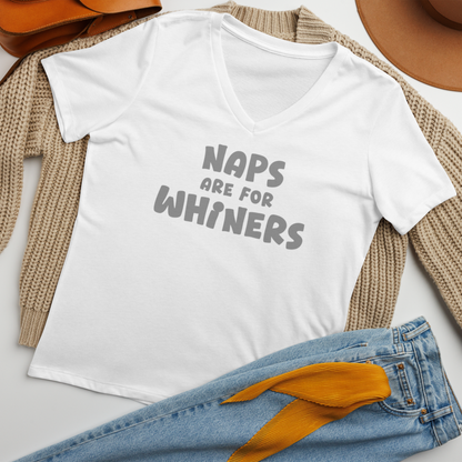 "Naps Are For Whiners" printed on a solid white blend women's relaxed v-neck t-shirt laying on a flat surface amongst other clothes