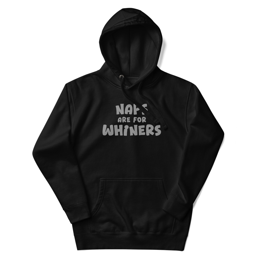 "Naps Are For Whiners" printed on a black unisex hoodie laying on a flat surface with the hood up