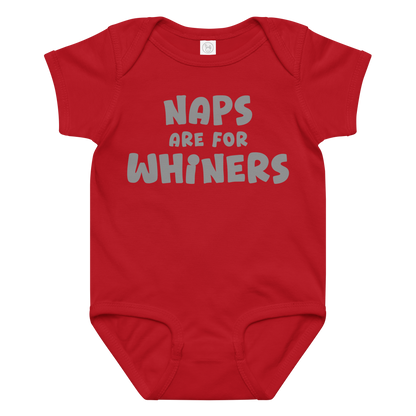 "Naps Are For Whiners" printed on a red baby jersey bodysuit laying on a flat surface amongst other clothes