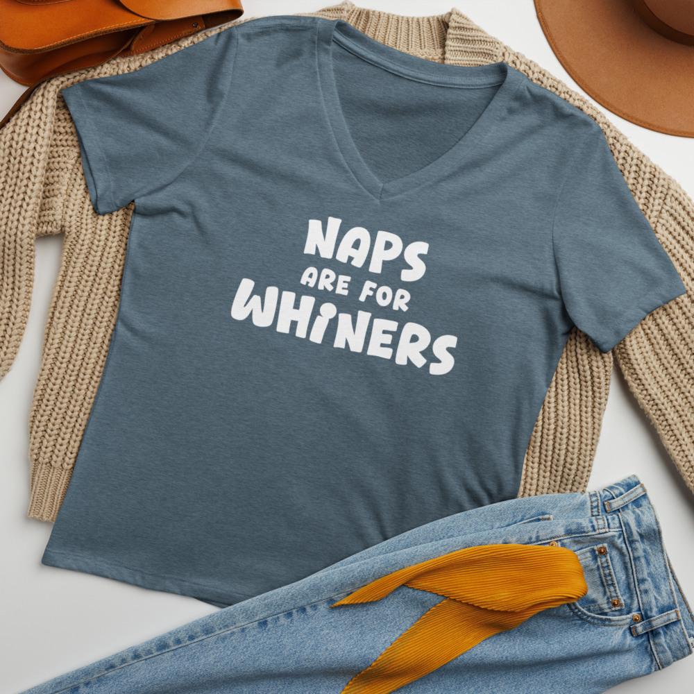 "Naps Are For Whiners" printed on a heather slate women's relaxed v-neck t-shirt laying on a flat surface amongst other clothes