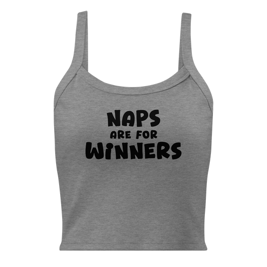 "Naps Are For Winners" printed on a athletic heather women's micro-rib tanktop laying on a flat surface