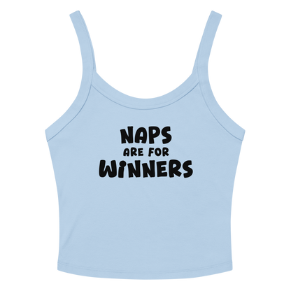 "Naps Are For Winners" printed on a solid baby blue blend women's micro-rib tanktop laying on a flat surface amongst sunglasses and shorts